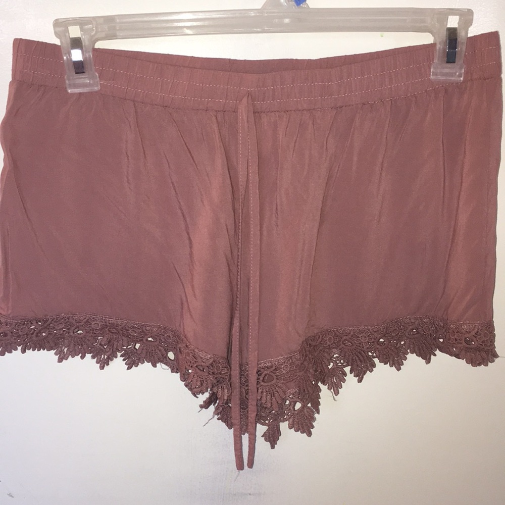 Deep pink shorts with flowered pattern